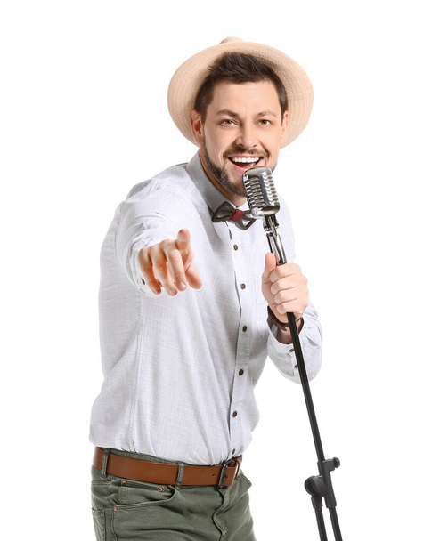 Handsome man singing against white background - Photo, Image