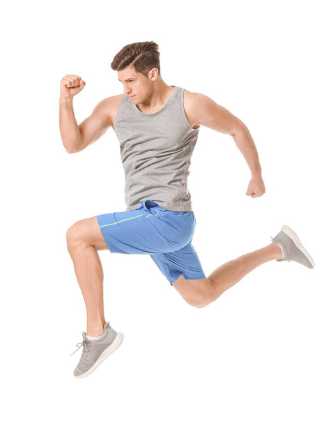 Sportos futó fiatalember fehér háttér - Fotó, kép