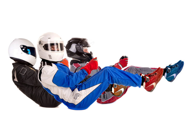 Racing driver in racing position with complete gear isolated in white - Photo, Image