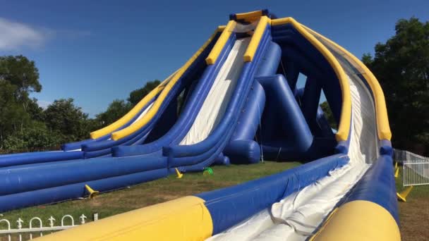 Young girl sliding down from a Giant inflatable slide in Australia Zoo in Sunshine Coast in Queensland, Australia. - Footage, Video