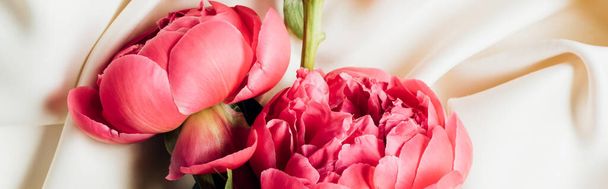 top view of pink beautiful peonies on white cloth, panoramic shot - Fotografie, Obrázek