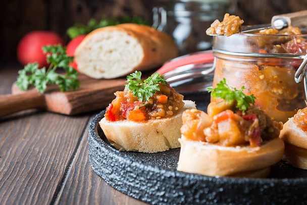 Bread toasts with eggplant caviar. Vegetable appetizer or antipasti. Healthy food for vegetarian - Фото, изображение