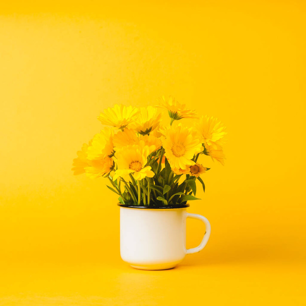 Yellow marigold on an yellow background - Photo, Image