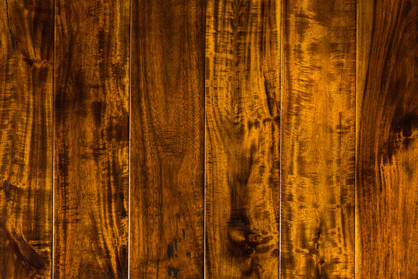 parquet from solid Sucupira wood (Bowdichia Nitida Benth or more commonly known as Brazilian Chestnut). sample of parquet. texture or background. wood texture. board. painted with natural oil. wax. - Photo, image