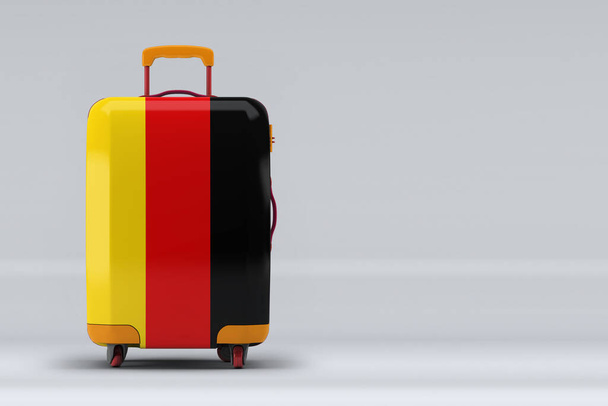 Germany national flag on a stylish suitcases on color background. Space for text. International travel and tourism concept. 3D rendering. - Foto, afbeelding