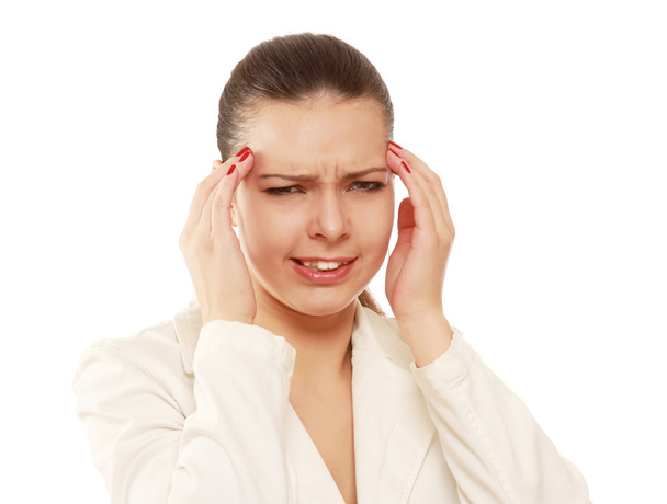 A woman having a headache - 写真・画像