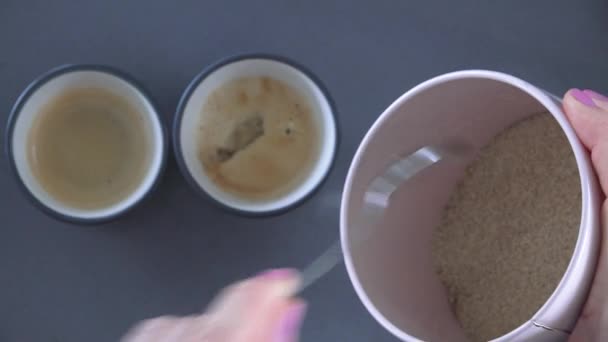 POV (Point of view) of Woman preparing espresso coffee with milk for two - Materiaali, video