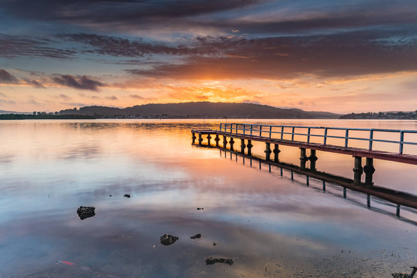 Sunrise Waterscape with Wharf from Woy Woy Waterfront on the Central Coast, NSW, Australia. - Фото, зображення