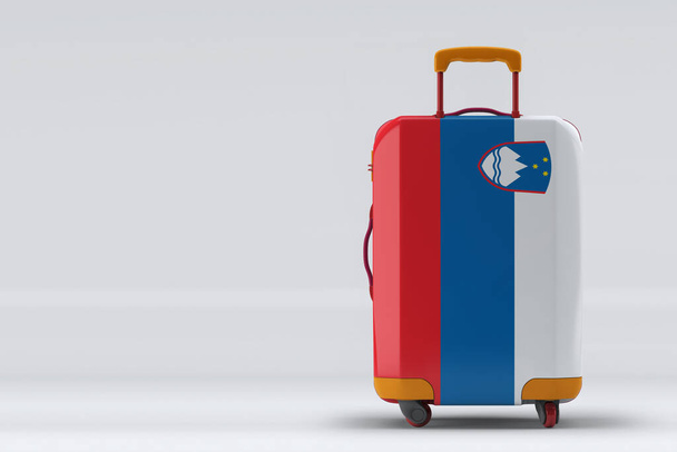 Slovenia flag on a stylish suitcases back view on color background. Space for text. International travel and tourism concept. 3D rendering. - Φωτογραφία, εικόνα