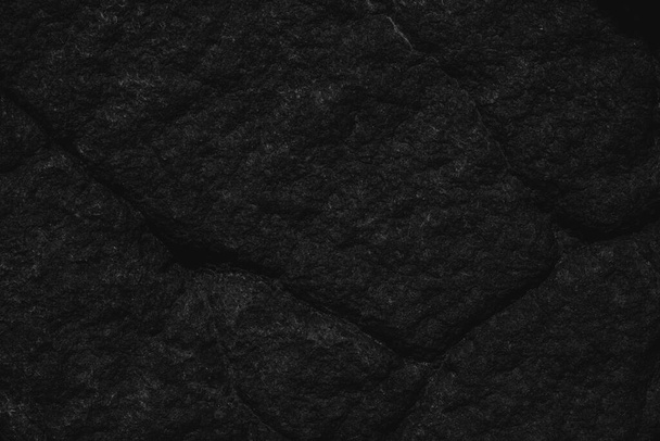 μαύρη υφή δαπέδου εσωτερικό και εξωτερικό πέτρινο τοίχο. Κενό για σχεδιασμό - Φωτογραφία, εικόνα