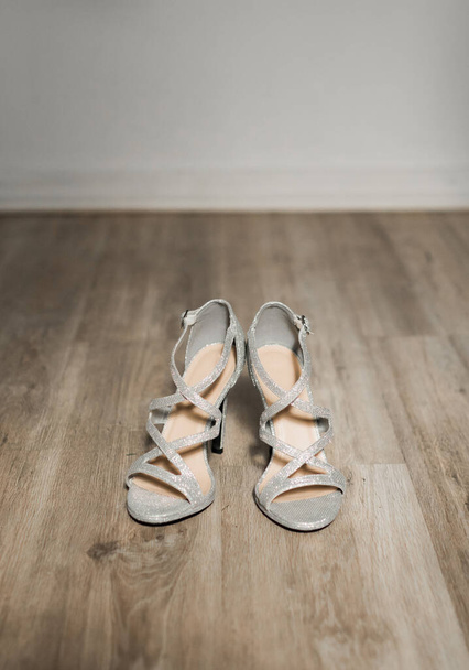 Morning bride fees. Bride wedding shoes on her tender feet. Wedding details. Prepare for ceremony - Photo, Image