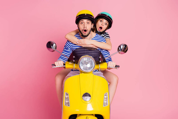 Portrait of his he her she nice attractive lovely cheerful cheery funny amazed positive couple riding moped spending vacation adventure having fun isolated on pink pastel color background - Zdjęcie, obraz