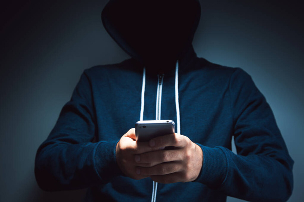 crime hacker using mobile phone  - Fotoğraf, Görsel