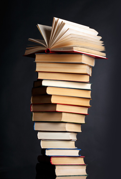 Pile of books on a black background - Photo, image