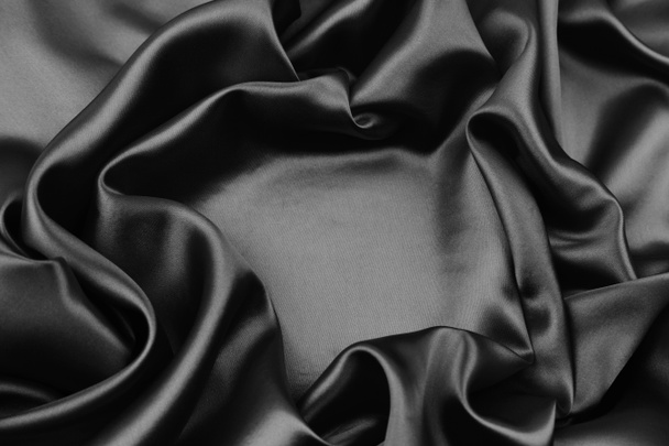 Gros plan de tissu de soie noire ondulée - Photo, image