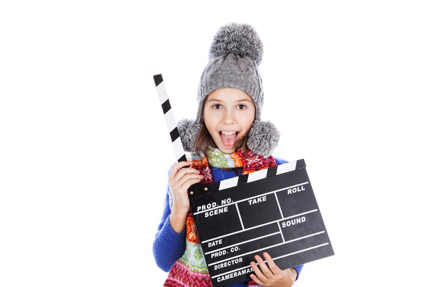 Little girl with a clapperboard - Foto, Imagen