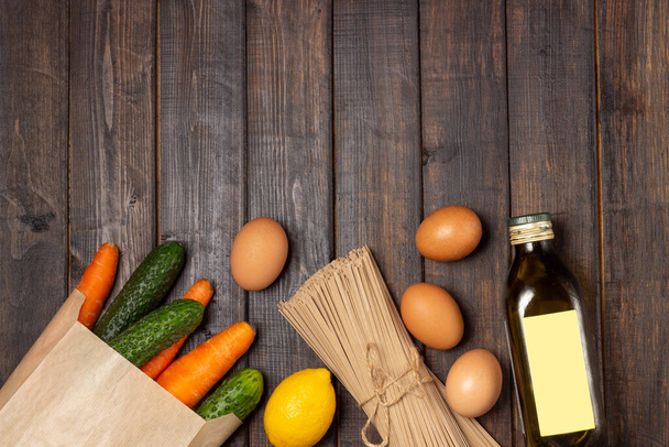 Food stock. Vegetables, eggs and pasta. Food delivery and donation service. Copy space. - Foto, Bild