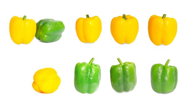 The collections of group of fresh yellow and green sweet or bell peppers with water droplets on smooth vivid skin, isolated and dicut with clipping path on white background - Photo, Image