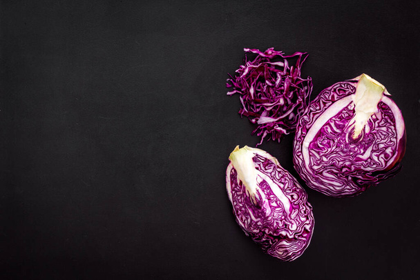 Red cabbage - cut head and sliced - on black desk from above copy space - Fotoğraf, Görsel