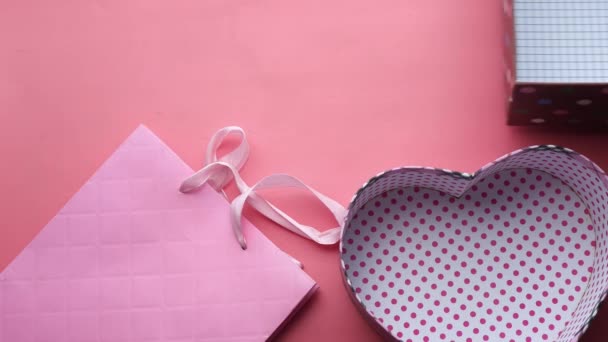 open empty gift box on pink background  - Filmati, video