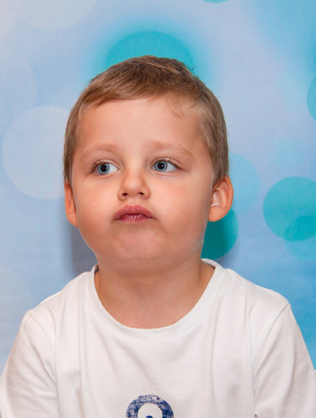 Child. Emotions. Funny boy. A boy with blue eyes. Portrait. - Foto, Bild