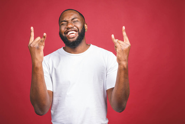 Portrait of African American man laughing isilated over red.  - Foto, immagini
