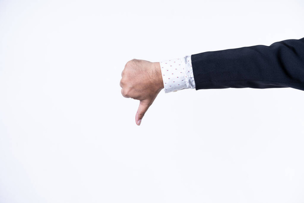 Closed up shot of a man in suit showing "NO" sign, seamless white background - Photo, Image