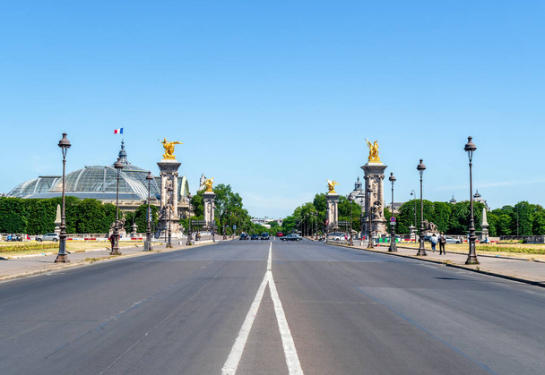 Avenue du Marechal-Gallieni and Esplanade des Invalides with Pont Alexandre III and Grand Palais in the background - Paris, France - Photo, image