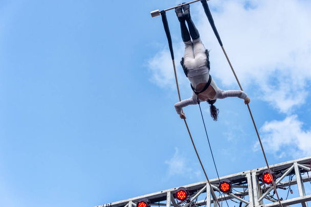Montreal, Canada - 14 July 2018: Trapeze artist performing during Montreal Completement Cirque festival - Photo, Image