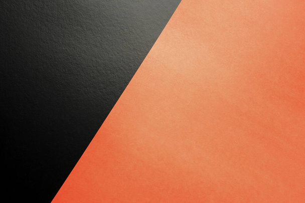 Geometrische achtergrond van zwart en oranje getextureerd papier. Veelkleurig papier. Creatieve platte lay-out met kopieerruimte. - Foto, afbeelding