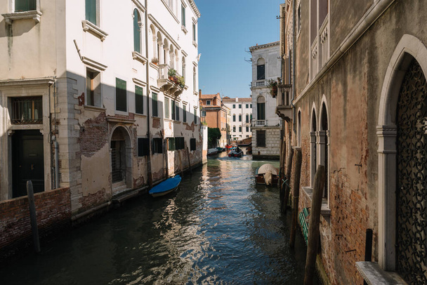 Venice, Italy - August 13, 2016: Boats on the canal of Venice, Italy. - 写真・画像