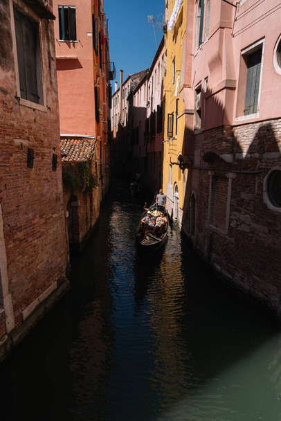 Venice, Italy - August 14, 2016: Gondoliers on the Canal of Cannaregio district of Venice, Italy. - 写真・画像