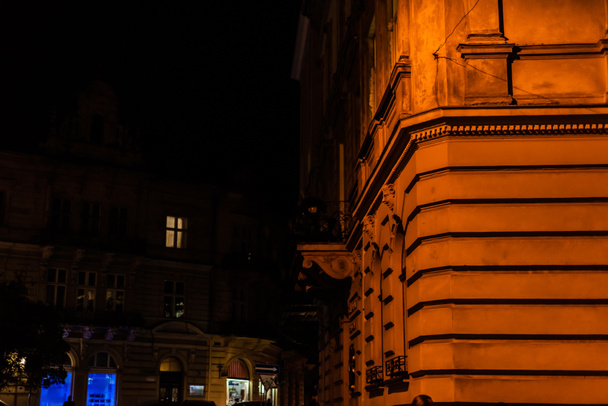 selective focus of old building at night city - Фото, изображение