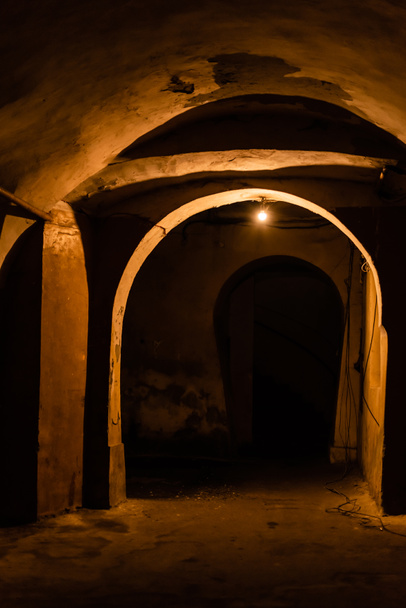 arch and old walls in ancient basement at night  - Fotó, kép
