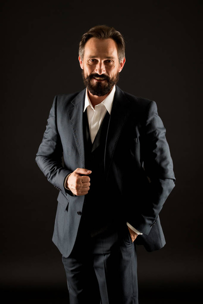 Menswear concept. Official event. Old fashioned. Classics eternal value. Bearded man with formal look. Businessman black background. Mature man in tuxedo suit. Classic look. Fashion shop. Buy clothes - 写真・画像