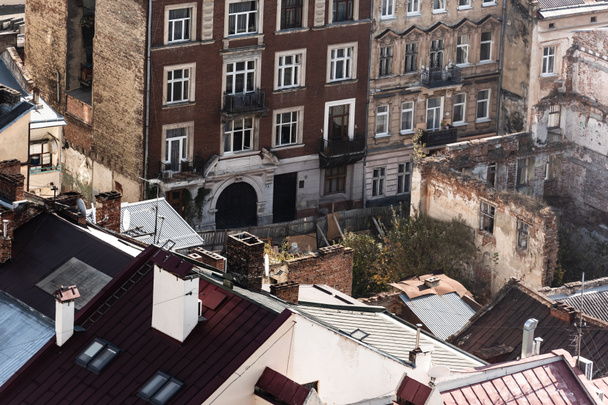 aerial view of old buildings and trees near house ruins in lviv, ukraine - Foto, Imagem