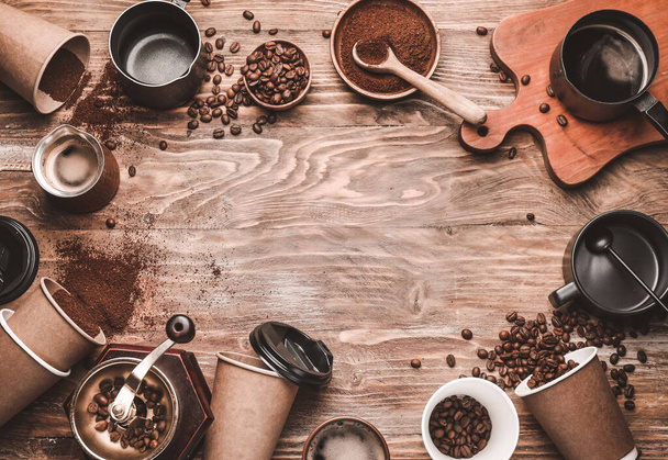 Composition with coffee beans and powder on wooden background - Photo, Image