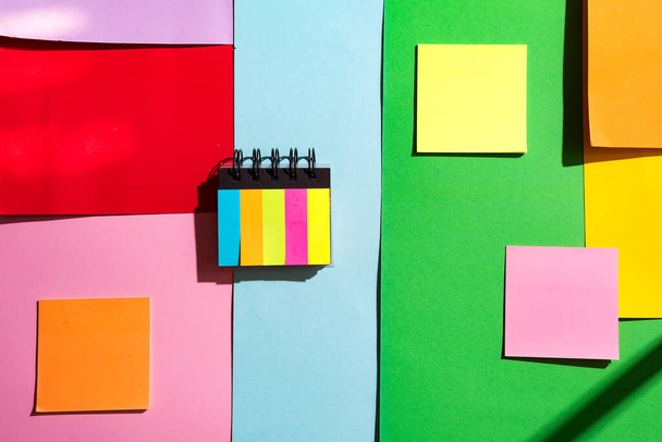 Colorful sticky notes on color paper background - Fotografie, Obrázek