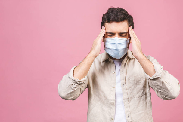 Protection against contagious disease, coronavirus. Man wearing hygienic mask to prevent infection, airborne respiratory illness such as flu, 2019-nCoV. Isolated on pink background. - Foto, Imagen