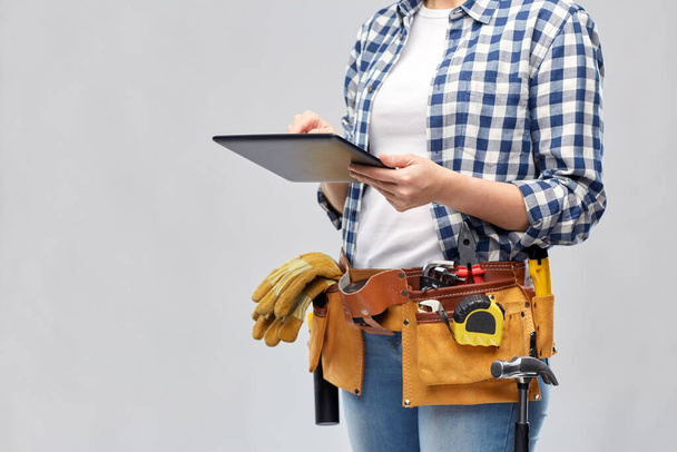 woman or builder with tablet pc and working tools - Fotografie, Obrázek