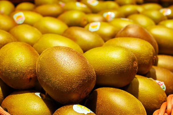 Fresh golden kiwi fruit in market. - Photo, Image