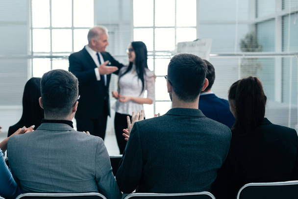boss introducing a speaker at a business presentatio - Foto, afbeelding