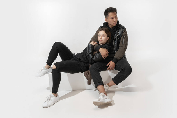 Trendy fashionable couple isolated on white studio background - Foto, Imagem