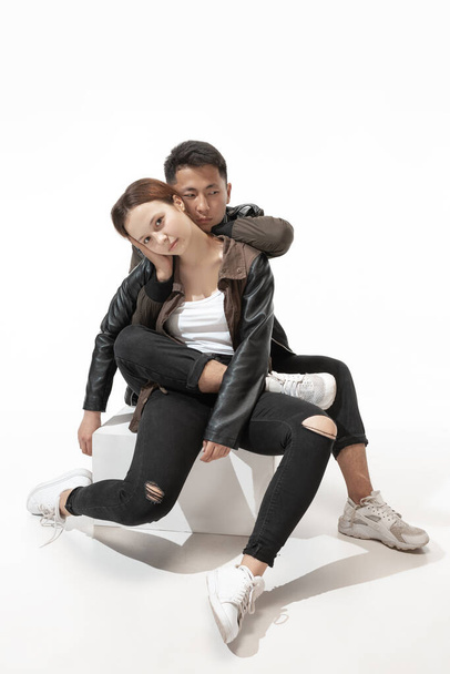 Trendy fashionable couple isolated on white studio background - Foto, imagen