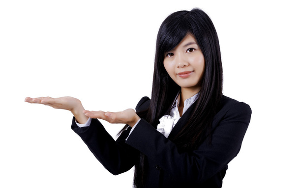 Business woman showing or holding on the palm blank copy space ov - Photo, Image