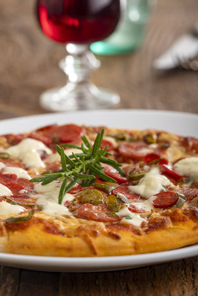rosemary leaf on a pizza  - Foto, Imagen