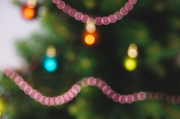 Defocused christmas background. Christimas tree, decoration and lights - Photo, image