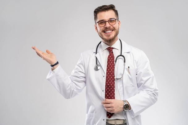 A portrait of a medical doctor posing against white background - Photo, Image