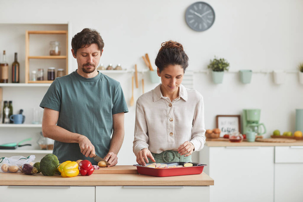 Couple preparing food in the kitchen - Photo, image