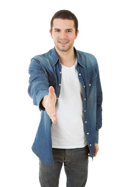 young casual man offering to shake the hand, isolated - Foto, Imagem